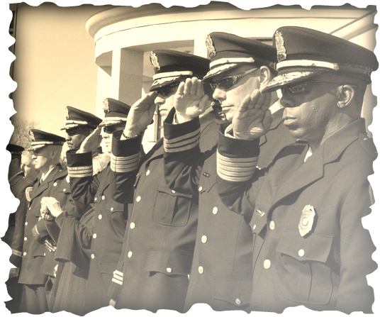 Law enforcement leaders gather at a training ceremony, officers of different races appear in the picture; picture is burned around the edges and has an antique filter to show the that this equality and righteousness is leaving our nation.